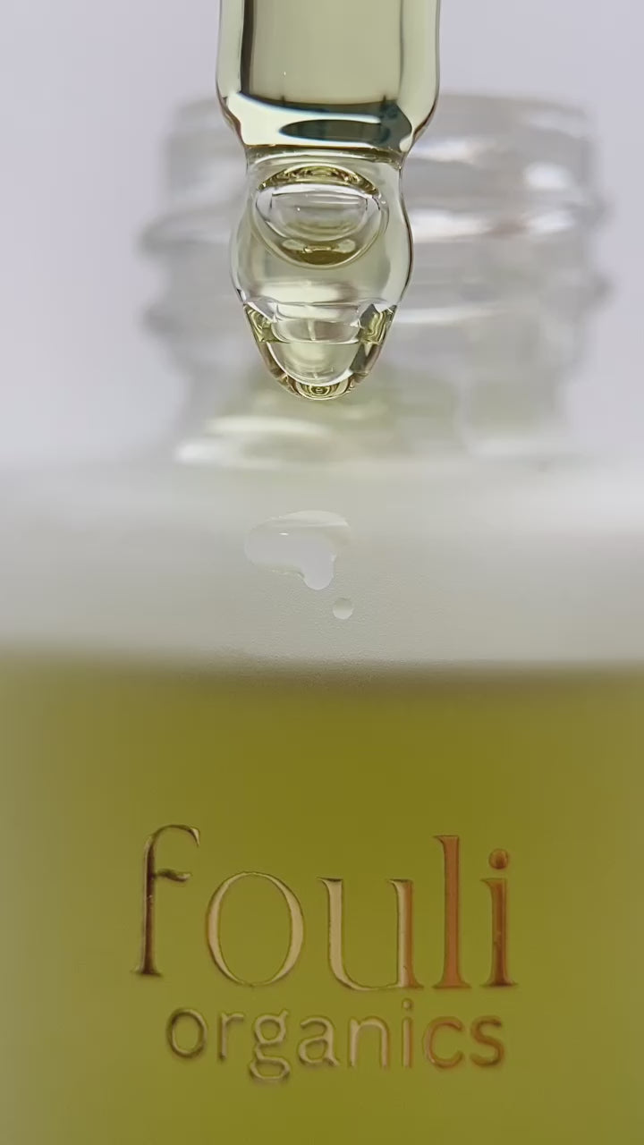 yellow scalp serum dripping on bottle